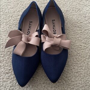 Rothy's Mary Jane The Point flat in sapphire blue with a pink bow